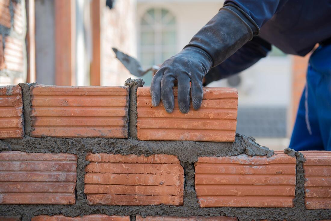 man doing brick layer